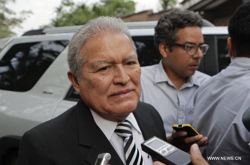 Salvadoran Vice President Salvador Sanchez Ceren speaks to reporters after the news of Venezuelan President Hugo Chavez's death was released, in San Salvador, capital of El Salvador, on March 5, 2013. Venezuelan President Hugo Chavez died on March 5. (Xinhua/Oscar Rivera)