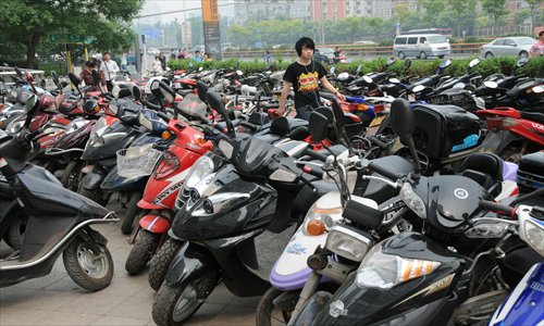 A rider parks his e-bike at Zhongguancun, Haidian district. 