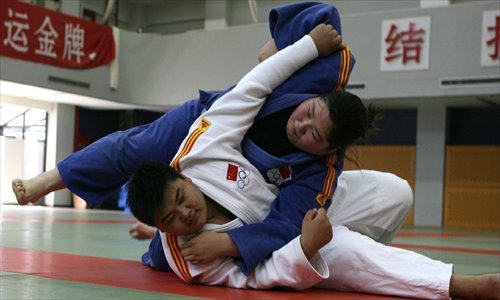 Liu Leilei practices with training partner Liu Yiqing from the national women's judo team. Photo: Xinhua
