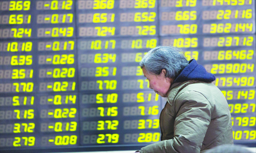 A retail investor sits in a brokerage house in Shanghai on February 21, when the stock market saw a major fall. Photo: CFP