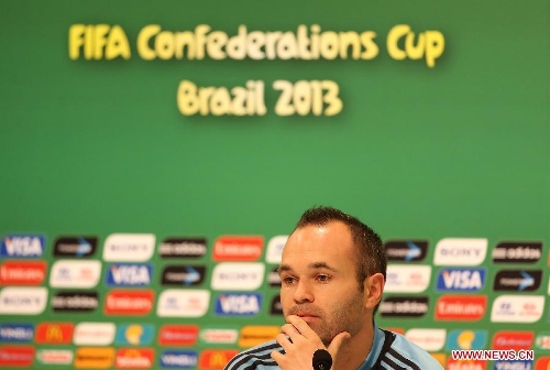Spain's Andres Iniesta participates in a press conference after a training session at Maracana Stadium, in Rio de Janeiro, Brazil, on June 19, 2013. Spain will play against Tahiti on Thursday on its second match during the FIFA Confederations Brazil 2013. (Xinhua/Liao Yujie)