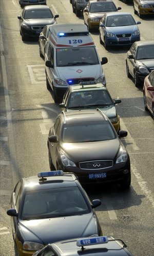 Few cars give way to a Beijing Emergency Medical Center ambulance during the rush hour on a road in Beijing on Monday. Photo: CFP
