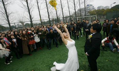 A couple celebrates their wedding in the grounds of their college in Wuhan, Hubei Province. Photo: CFP
