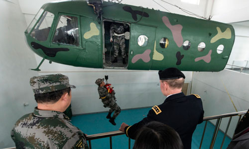 Dempsey observes as soldiers train during his tour of a Chinese army aviation base on April 24.