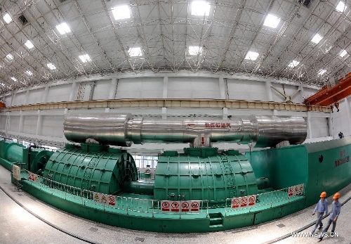 File photo taken on May 24, 2012 shows the scene of the Gujiao Power Plant in Taiyuan, capital of north China's Shanxi Province. According to the latest data released by the State Energy Administration, China has become the world's largest energy producer by the end of 2012. The total installed electricity capacity was 1.14 billion kilowatts, including 249 million of hydropower capacity which was the world's largest. The installed wind power capacity stood at 63 million kilowatts, making China the world's No. 1 in this field. The nuclear power under construction is also the world's largest. (Xinhua/Yan Yan) 