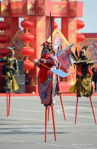 Performers take part in a Shehuo parade in Longxian County, northwest China's Shanxi Province, Feb. 22, 2013. The performance of Shehuo can be traced back to ancient rituals to worship the earth, which they believe could bring good harvests and fortunes in return. Most Shehuo performances take place around traditional Chinese festivals, especially the Spring Festival and the Lantern Festival. (Xinhua/Li Yibo) 