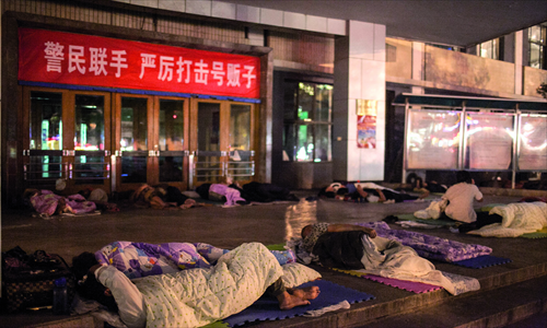 Due to long waits, people keep their place in line overnight. 

