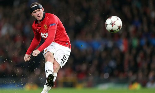 Manchester United's Wayne Rooney shoots against Bayer Leverkusen during their European Champions League match at Old Trafford in Manchester on Tuesday. Photo: CFP