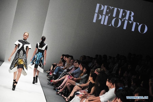 &nbsp;Models present creations by British designer Peter Pilotto during the Audi Fashion Festival held in Singapore's Marina Bay, May 18, 2013. (Xinhua/Then Chih Wey) 