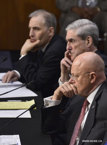 (L to R) National Counterterrorism Center Director Matthew Olsen, FBI Director Robert Mueller and Director of National Intelligence James Clapper testify before the Senate Select Intelligence Committee during a hearing on 