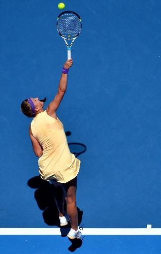 Victoria Azarenka of Belarus serves the ball during her first round women's singles match against Monica Niculescu of Romania on the second day of 2013 Australian Open tennis tournament in Melbourne, Australia, Jan. 15, 2013. Victoria Azarenka won 2-0 to enter the next round. (Xinhua/Chen Xiaowei) 