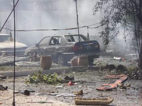 &nbsp;Remains of a car is seen at the site of a car bomb attack at Karada district in Baghdad, Iraq, March 19, 2013. At least 48 people were killed and 167 others wounded in a series of bombings and shootings in the Iraqi capital of Baghdad on Tuesday, an Interior Ministry source said. (Xinhua/Bashar)