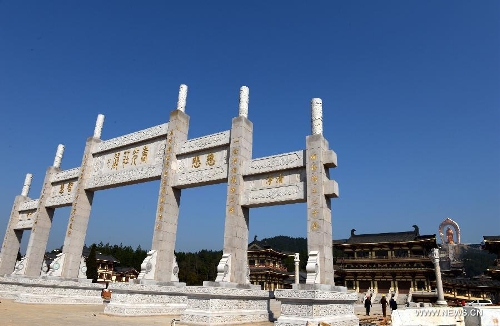 Photo taken on March 6, 2013 shows the entrance leading to the Donglin Buddha statue at the Donglin Temple in Xingzi County of Jiujiang City, east China's Jiangxi Province, March 6, 2013. The bronze statue of Amitabha Buddha, which is 48 meters in height, is believed to be the tallest of its kind in the world. The project, with the total cost of about 1 billion yuan (161 million U.S. dollars), has been basically completed. It was totally funded by private donations. (Xinhua/Song Zhenping)  