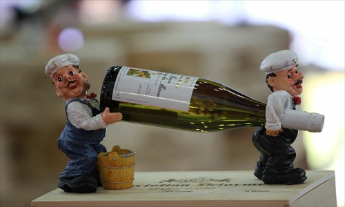 A bottle of wine is displayed at the Second China (Wuhan) International Wine and Spirits Expo, which ended Monday in Wuhan, Central China's Hubei Province. Although real estate and stocks were still the preferred investment options for Chinese millionaires, 48 percent of them also chose wine and spirits, according to a report on China's alternative investments conducted by Hurun Report and the Industrial Bank Co last week. Photo: CFP 