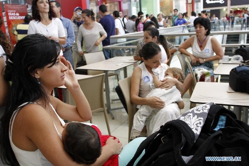 Young mothers attend a breastfeeding activity at the Plaza Lincoln shopping center in San Jose, Costa Rica, Jan. 12, 2013, to call for the rights for mothers' breastfeeding their children in public places. (Xinhua/Kent Guilbert) 