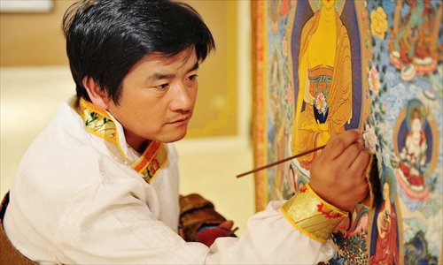 Chudri working on a Thangka painting