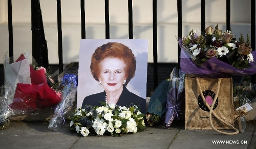 Flowers are laid outside the residence of Baroness Thatcher at the Chester Square in London, Britain, on April 8, 2013. It has been confirmed that Lady Thatcher died this morning following a stroke at the age of 87. (Xinhua/Wang Lili) 
