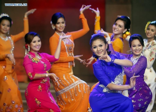 Performers dance during the Myanmar women's traditional culture and dressing style show at the National Theater in Yangon, Myanmar, June 29, 2013. The show was held here in commemoration of Myanmar Women's Day falling on July 3. (Xinhua/U Aung) 