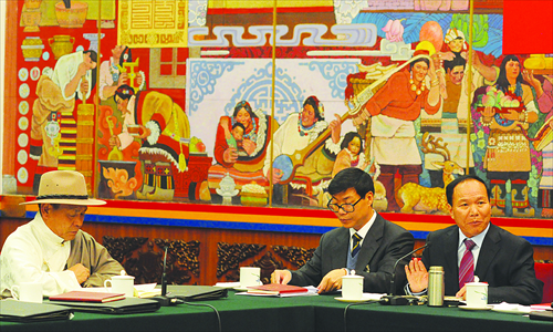 Members of the Tibet Autonomous Region delegation to the 18th National Congress of the Communist Party of China take part in a group discussion at the Great Hall of the People in Beijing on Friday. Photo: Wu Gang/GT