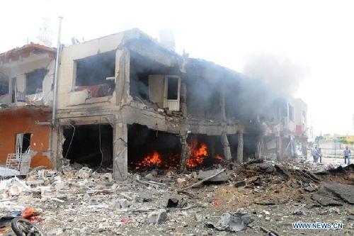 Photo taken on May 11, 2013 shows the site of an explosion in the town of Reyhanli, in the southern Turkish province of Hatay. At least 40 people were killed and 100 others injured after explosions shook a Turkish town on Saturday near the border with Syria, Turkish Interior Minister Muammer Guler said. (Xinhua/NTV) 
