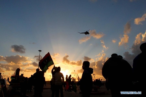 &nbsp;Libyan people attend a celebration for the second anniversary of the uprising that toppled the regime of strongman Muammar Gaddafi in Benghazi, on Feb. 17, 2013. (Xinhua/Mohammed El Shaiky) 