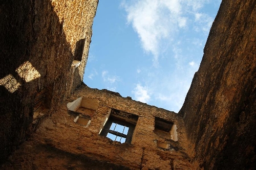 Photo taken on April 28, 2013 shows a scene of Fort Jesus in Mombasa, Kenya. The Fort, built by the Portuguese in 1593-1596 to the designs of Giovanni Battista Cairati to protect the port of Mombasa, is one of the most outstanding and well preserved examples of 16th Portuguese military fortification and a landmark in the history of this type of construction. The Fort's layout and form reflected the Renaissance ideal that perfect proportions and geometric harmony are to be found in the human body. The property covers an area of 2.36 hectares and includes the fort's moat and immediate surroundings. The UNESCO added the Fort Jesus to World Heritage List as a cultural site in 2011. (Xinhua/Meng Chenguang)&nbsp;