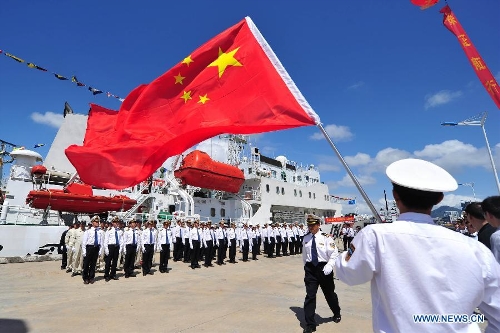 Marine patrol staff members get ready to conduct a coast guard mission at the port of Sanya, south China's Hainan Province, Feb. 28, 2013. A formation of three marine patrol ships 