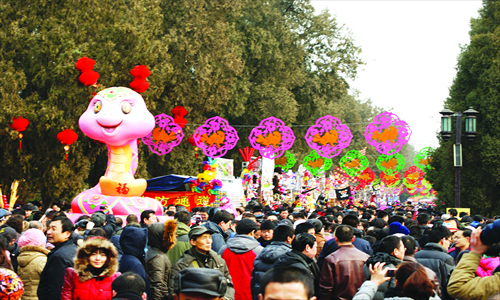 4. Revelers flock to the Temple of the Earth for the opening day of its fair. 
