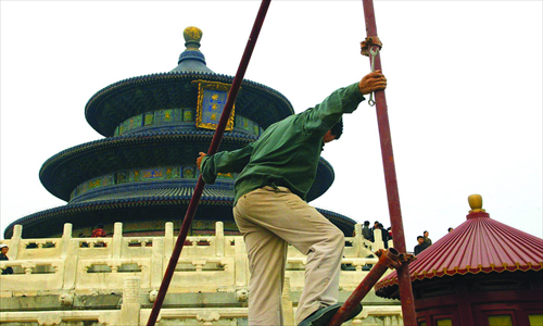 Above: A man on scaffolding at the Temple of Heaven. Photo: CFP

