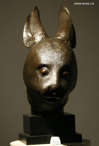 This file photo taken on Feb. 21, 2009 shows the Chinese bronze rabbit head sculpture displayed at the Grand Palais in Paris, France. The family of French luxury goods retailer Pinault announced Friday in Beijing that it will donate two pieces of Chinese cultural relics looted by Anglo-French allied forces during the Second Opium War in 1860, including the rabbit head, back to China. (Xinhua/Zhang Yuwei) 