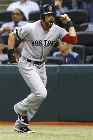 Boston Red Sox's Jacoby Ellsbury celebrates after scoring on a hit by Shane Victorino in the baseball game against the Tampa Bay Rays  in St. Petersburg, Florida on Tuesday. Photo: IC