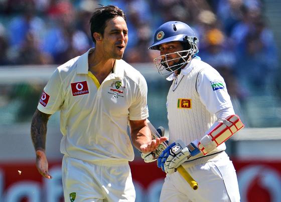Australian bowler Mitchell Johnson (left) celebrates dismissing Sri Lankan batsman Tillakaratne Dilshan on Wednesday. Photo: IC