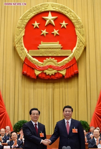  Hu Jintao (L) congratulates Xi Jinping at the fourth plenary meeting of the first session of the 12th National People's Congress (NPC) in Beijing, capital of China, March 14, 2013. Xi was elected president of the People's Republic of China (PRC) and chairman of the Central Military Commission of the PRC at the NPC session here on Thursday. (Xinhua/Ma Zhancheng)