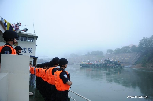 Chinese policemen are fully prepared to start off to carry out the joint anti-drug campaign on the Mekong River at the Guanlei Port in Xishuangbanna, southwest China's Yunnan Province, April 20, 2013. It is the ninth joint action of China, Laos, Myanmar and Thailand since a joint statement on the river's safety by the four nations dated Oct. 31, 2011. The Mekong river is a major Southeast Asian trading route, where narcotics crimes continue to rage. (Xinhua/Wang Dingbin) 