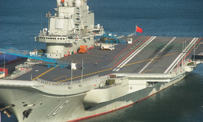 The Liaoning, China's first aircraft carrier, parks at a dock in Dalian, Liaoning Province on Monday after finishing its second round of test runs in the sea. J-15 jet fighters have reportedly successfully taken off and landed on the deck of the ship during this two-week testing session. Photo: CFP