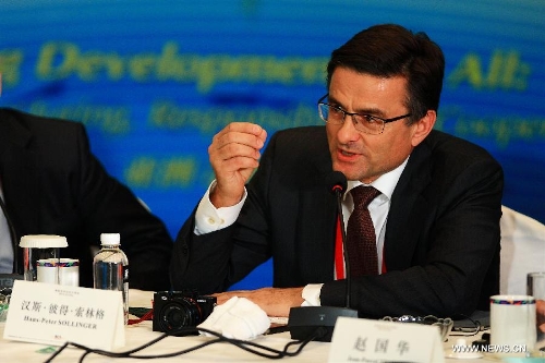 President and CEO of Voith Paper Hans-Peter Sollinger speaks during a roundtable discussion themed in 