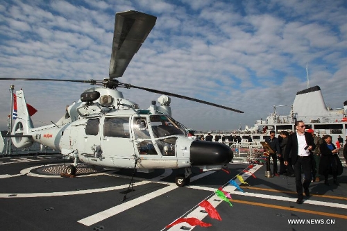 People visit the frigate Huangshan of the 13th naval escort squad sent by the Chinese People's Liberation Army (PLA) Navy at the Toulon harbour in France, April 23, 2013. The 13th convoy fleet including the frigates Huangshan and Hengyang and the supply ship Qinghaihu arrive in Toulon, France on Tuesday, beginning a five-day visit to the country. (Xinhua/Gao Jing)