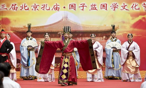Actors perform an ancient ritual at the opening ceremony of the No.3 Beijing Chinese Classics and Culture Festival at the Confucius Temple in Dongcheng district Sunday. The festival will last until September 28. Photo: CFP

