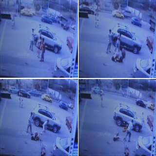 Screen shots taken from a surveilance camera video on Aug. 10, 2012 show an armed robbery in front of a bank in southwest China's Chongqing Municipality. One person was shot dead and two others were injured in an armed robbery in Chongqing Municipality Friday morning. Police have launched a manhunt for the serial killer believed to be behind the robbery. Photo: Xinhua