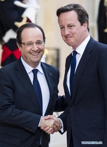 French President Francois Hollande (L) meets with British Prime Minister David Cameron at the Elysee Palace in Paris, France, May 22, 2013. French President Francois Hollande and British Prime Minister David Cameron on Wednesday condemned the assassination of a British soldier in the suburbs of London after their meeting in Paris. (Xinhua/Etienne Laurent)