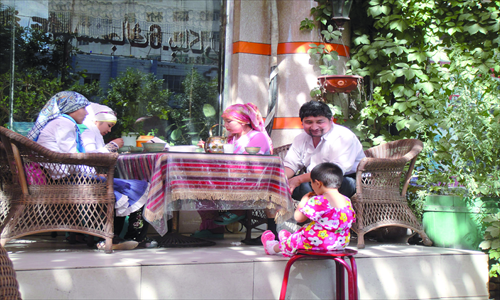 A Uyghur family having lunch together
