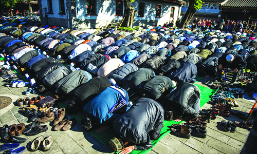 Thousands pray ahead of the animal sacrifice later that day. Photo: Li Hao/GT