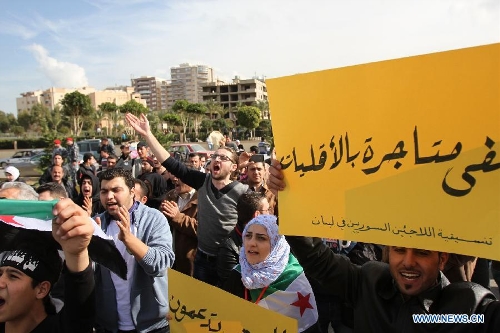  Syrian refugees hold a rally to call on assistance from international society in front of the U.N. office in Tripoli, northern Lebanon, on Jan. 24, 2013. Since March 2011, the crisis in Syria has left tens of thousands people killed and millions in need of assistance. In addition, large numbers of Syrians have fled their homeland for refuge in neighboring countries. (Xinhua/Omar)   
