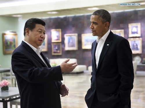 Chinese President Xi Jinping (L) talks with U.S. President Barack Obama after their meeting at the Annenberg Retreat, California, the United States, June 7, 2013. (Xinhua/Lan Hongguang) 