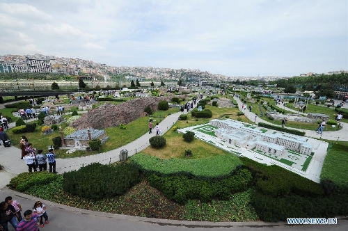 People visit the Miniature park in Istanbul, Turkey, on May 11, 2013. The Miniaturk park is the first miniature park in Istanbul and has welcomed 6.5 million visitors over the past 10 years. (Xinhua/Lu Zhe)