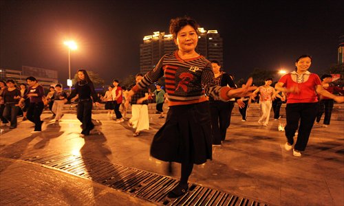 Women enjoying a nighttime dance together Photo: IC