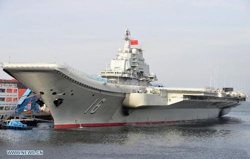 Undated photo shows an aircraft carrier berthing in a port of China. China's first aircraft carrier was delivered and commissioned to the Navy of the Chinese People's Liberation Army on September 25, 2012. The carrier, with the name 