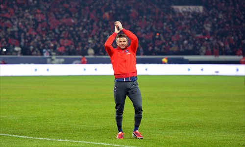 David Beckham waves to the crowd before the French Ligue 1 soccer match between PSG and Olympique de Marseille at the Parc des Princes stadium in Paris on February 24. Photo: AFP