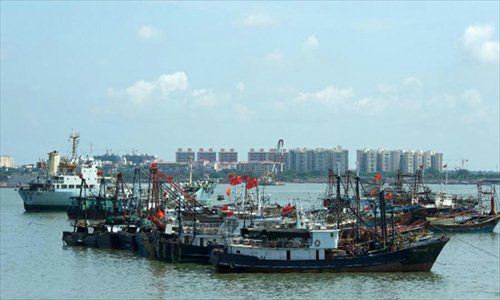 A fishing fleet is about set sail for Nansha Islands at the Baimajing Harbor in Danzhou City, south China's Hainan Province, May 6, 2013. Thirty Chinese fishing vessels on Monday set off for the Nansha Islands in the South China Sea. The fishing ships, each with a capacity exceeding 100 tonnes, will stay around the Nansha Islands for 40 days. Photo: Xinhua