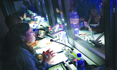 Interpreters work at the 2012 Annual Meeting of the New Champions, also dubbed the Summer <a href=